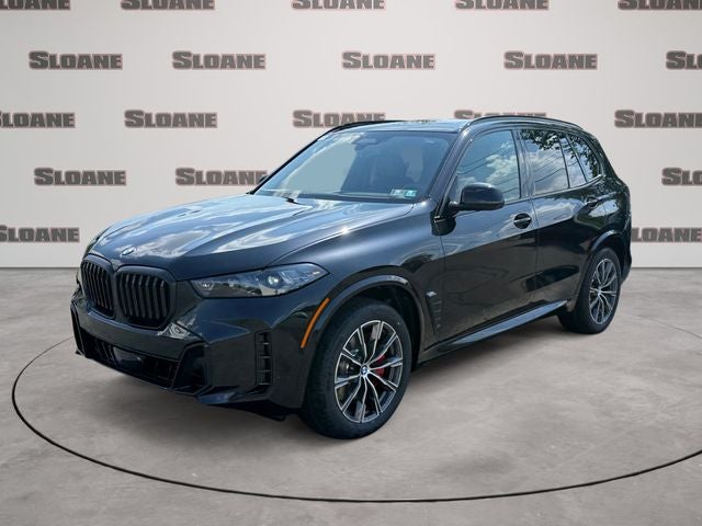 2026 BMW X5 xDrive40i in Black Sapphire Metallic — front three-quarter view