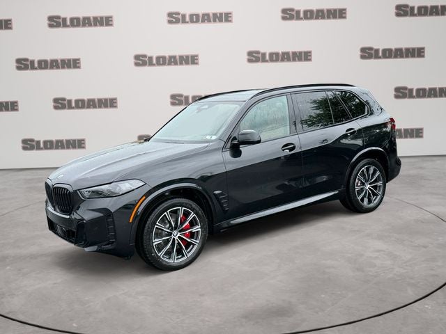 2026 BMW X5 xDrive40i in Black Sapphire Metallic — front three-quarter view