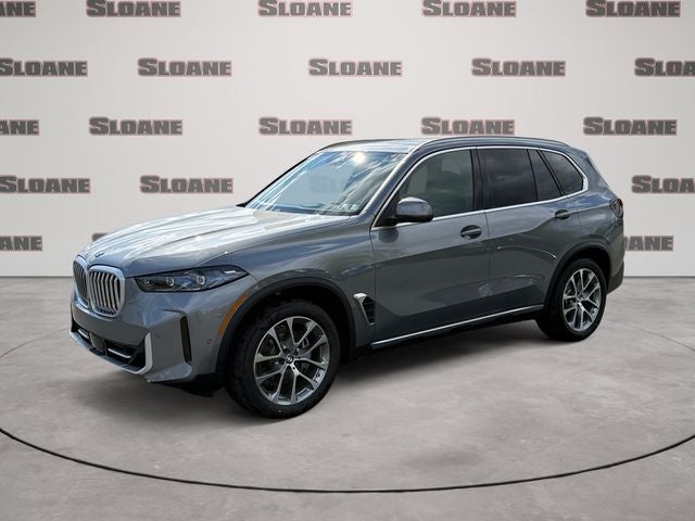 2026 BMW X5 xDrive40i in Gray Metallic — front three-quarter view