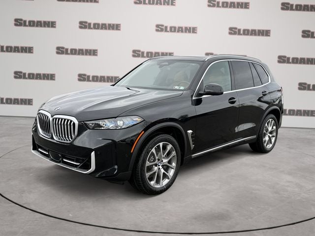 2026 BMW X5 xDrive40i in Black Sapphire Metallic — front three-quarter view