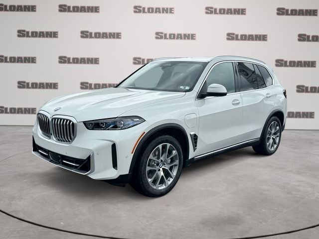 2026 BMW X5 xDrive50e in Mineral White Metallic — front three-quarter view