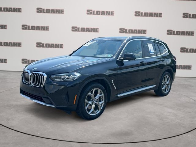 2023 BMW X3 xDrive30i in Black Sapphire Metallic — front three-quarter view