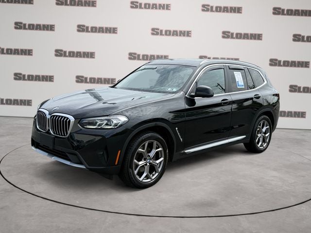2024 BMW X3 xDrive30i in Black Sapphire Metallic — front three-quarter view