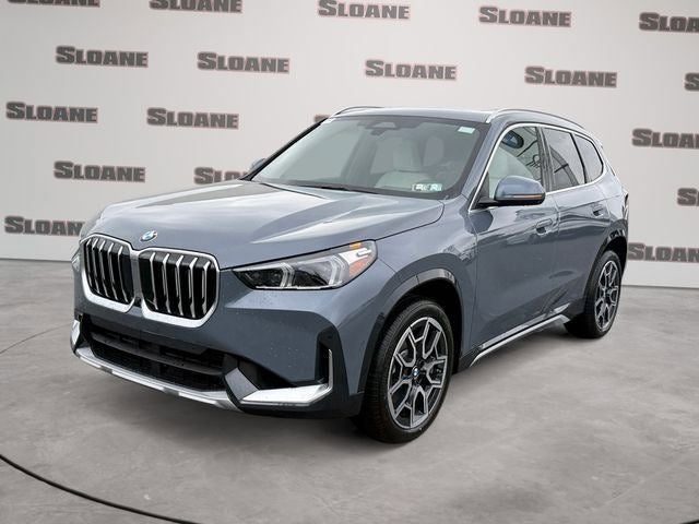 2026 BMW X1 xDrive28i in Storm Bay Metallic — front three-quarter view