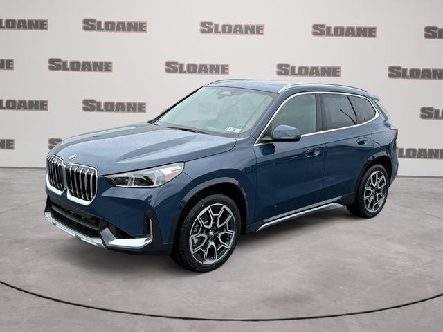 2026 BMW X1 xDrive28i in Blue Metallic — front three-quarter view